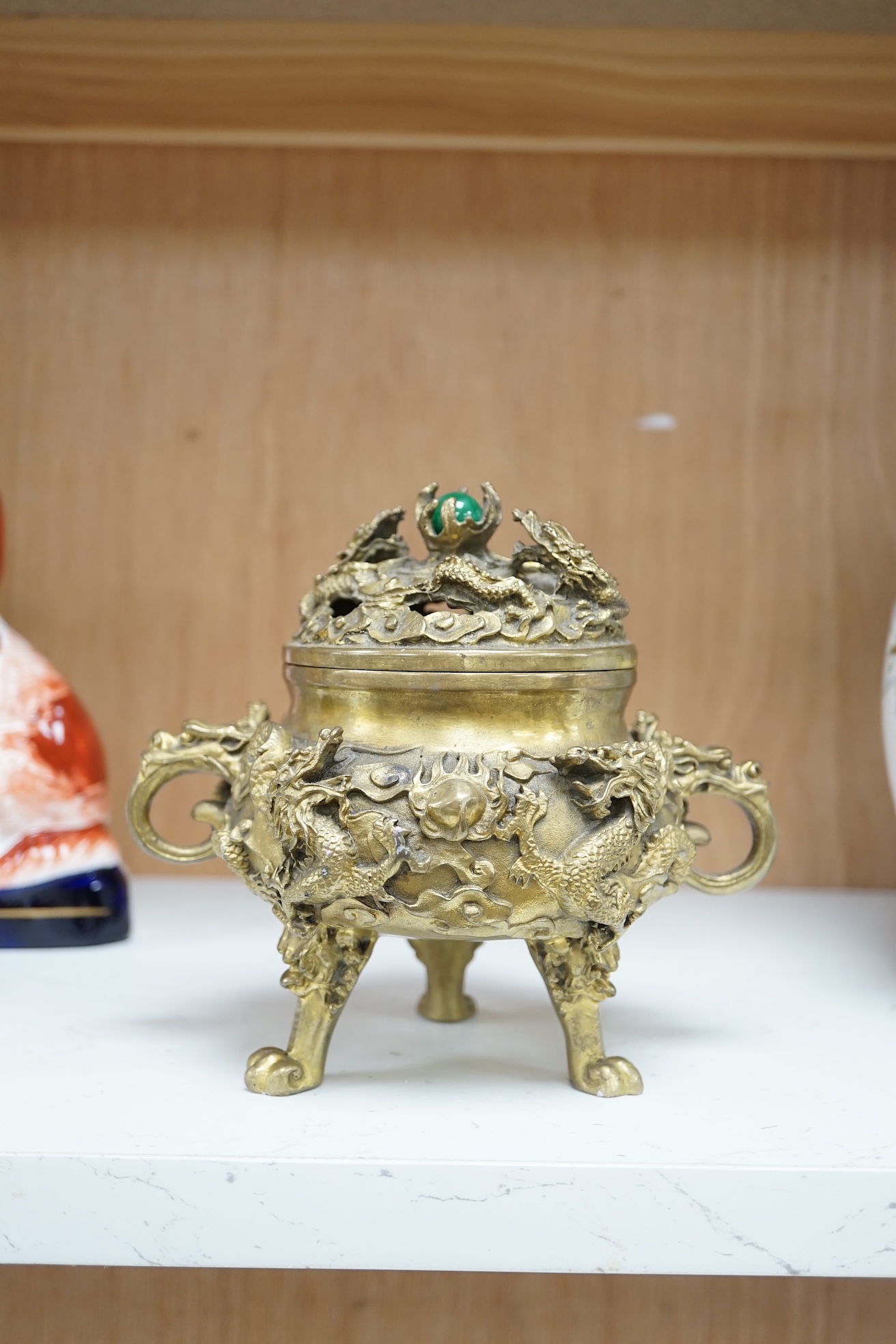 A Chinese bronze lidded censer, with jade bead insert in the finial, 15cm high. Condition - good.